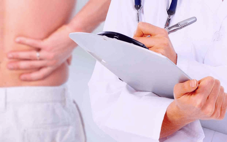 Doctor prescribes treatment for back pain